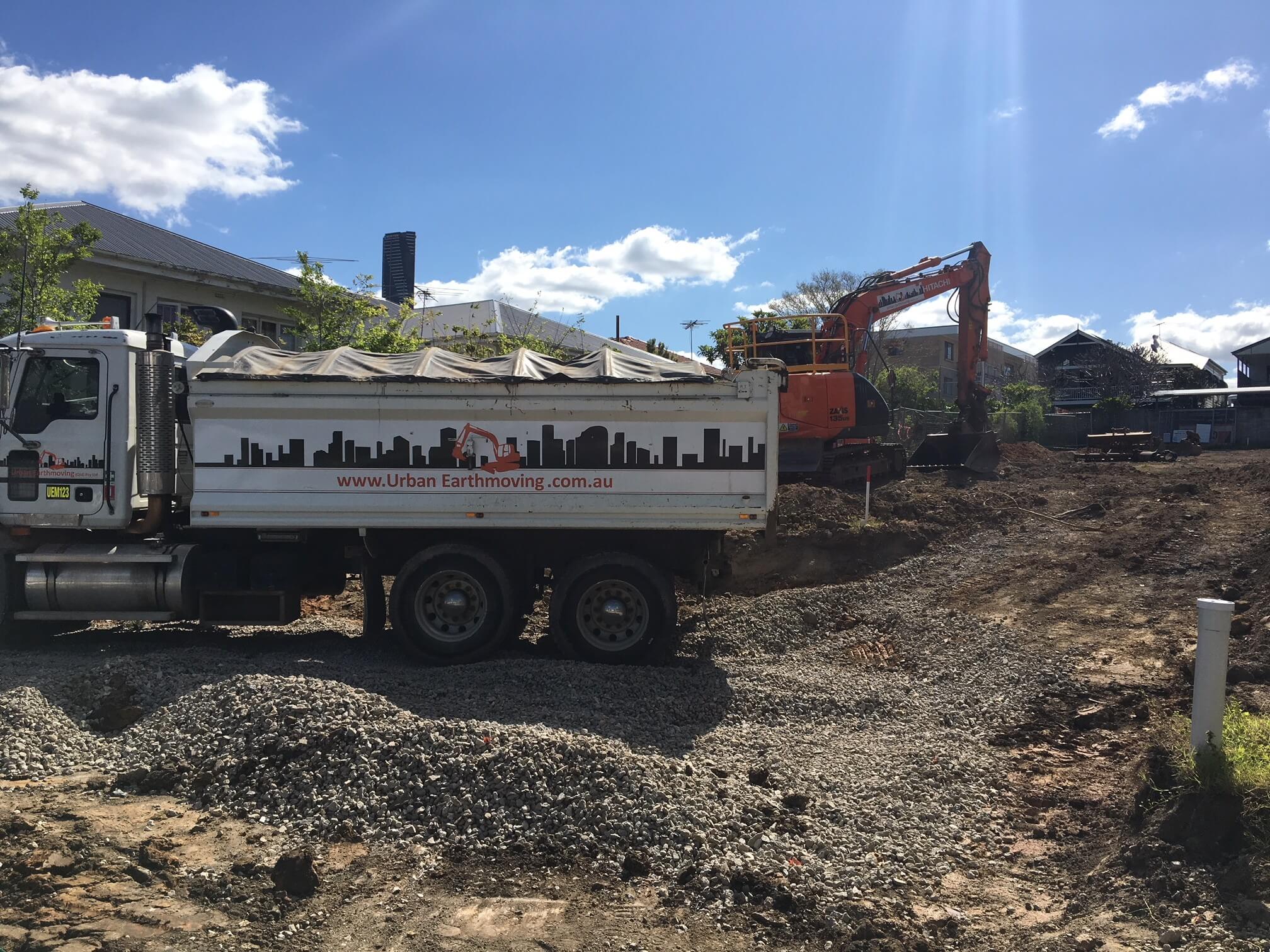 New Farm multi-residential A truck from Urban Earthmoving and an excavator in a completed demolition site