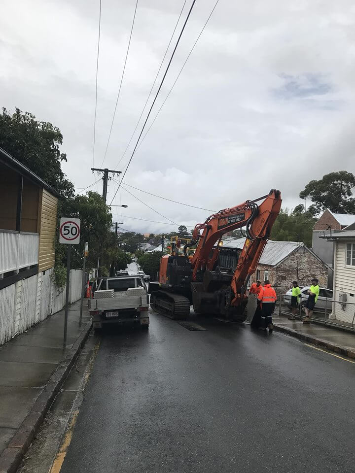 New Farm multi-residential A large excavator driving through a New Farm street in Brisbane