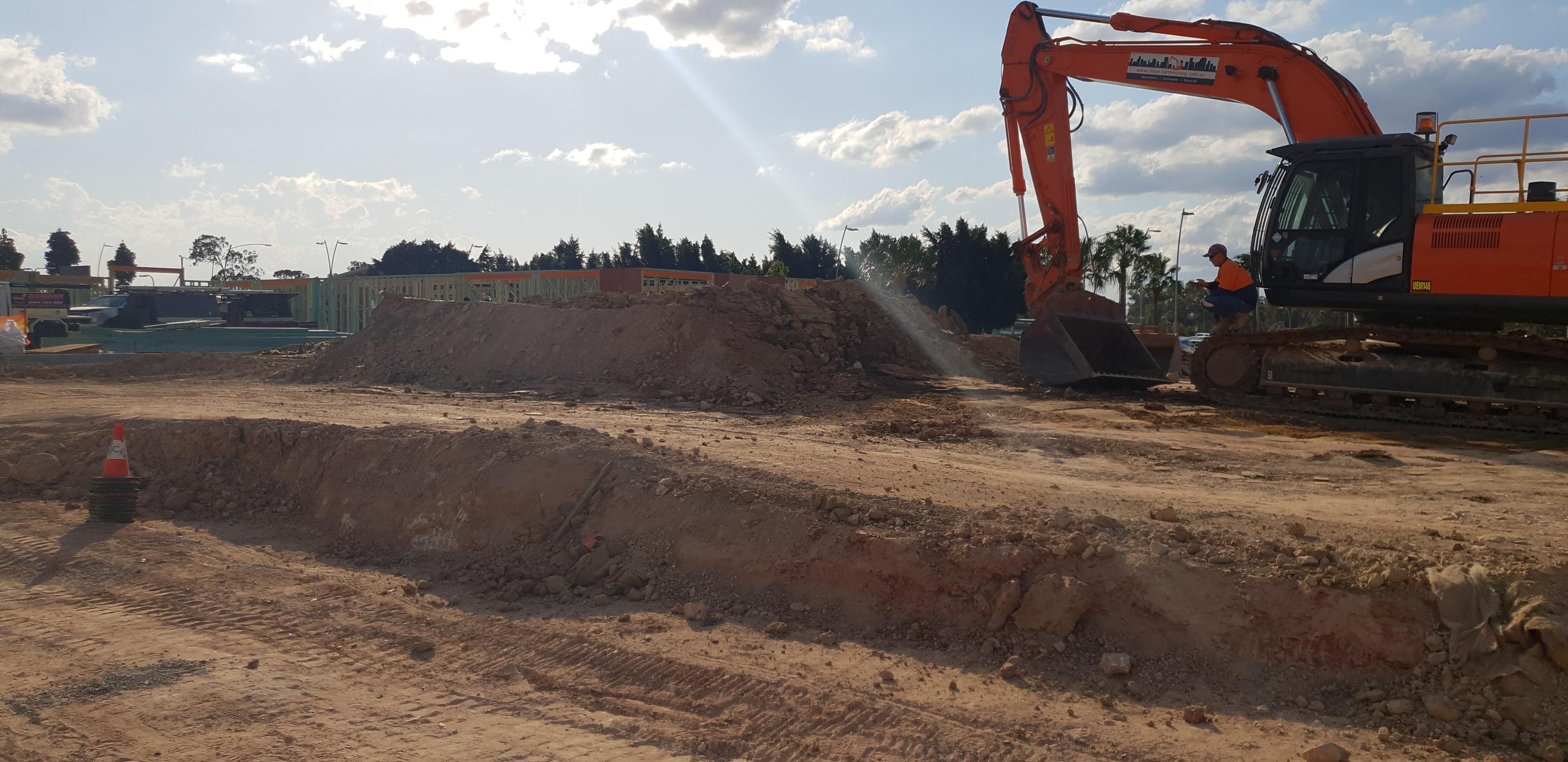 Richlands Bulk Earthworks A large excavator in a flat demolition area