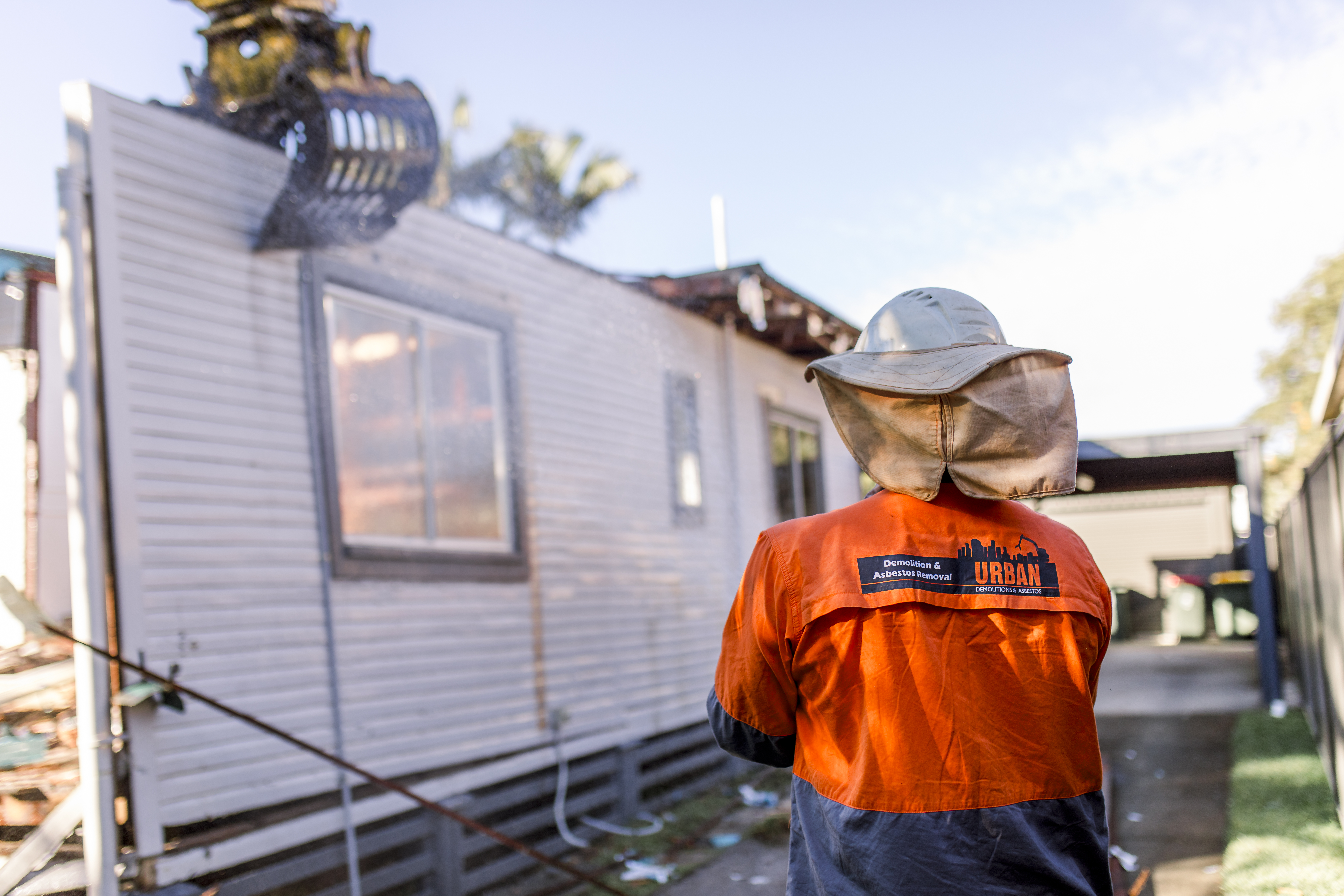 Demolition Services Brisbane Two Urban Demolition employees assessing their work after a demolition job